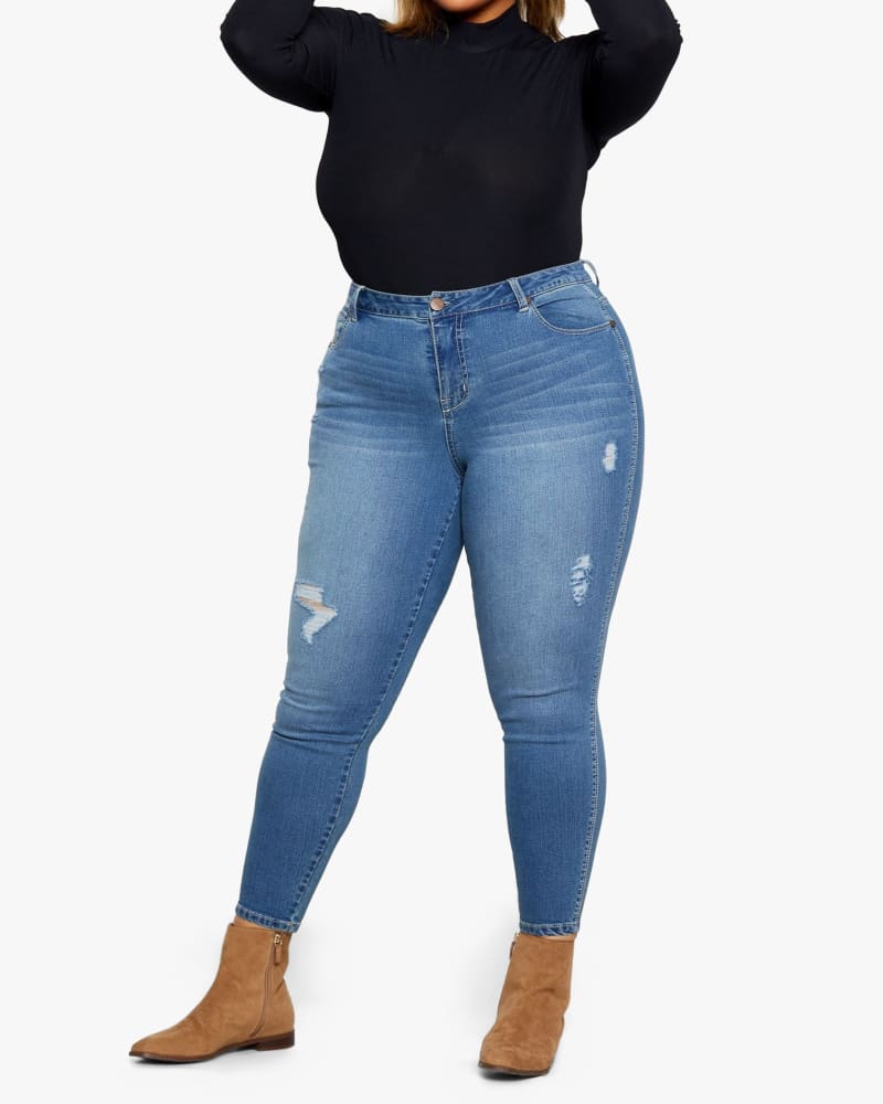Front of a model wearing a size 14 Valerie Destructed Skinny Jean in Maribel by 1822 Denim. | dia_product_style_image_id:154740